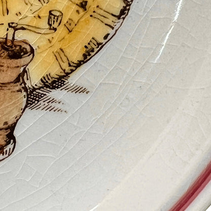 Close-up of a ceramic plate with a decorative edge featuring a stylized figure and pot.