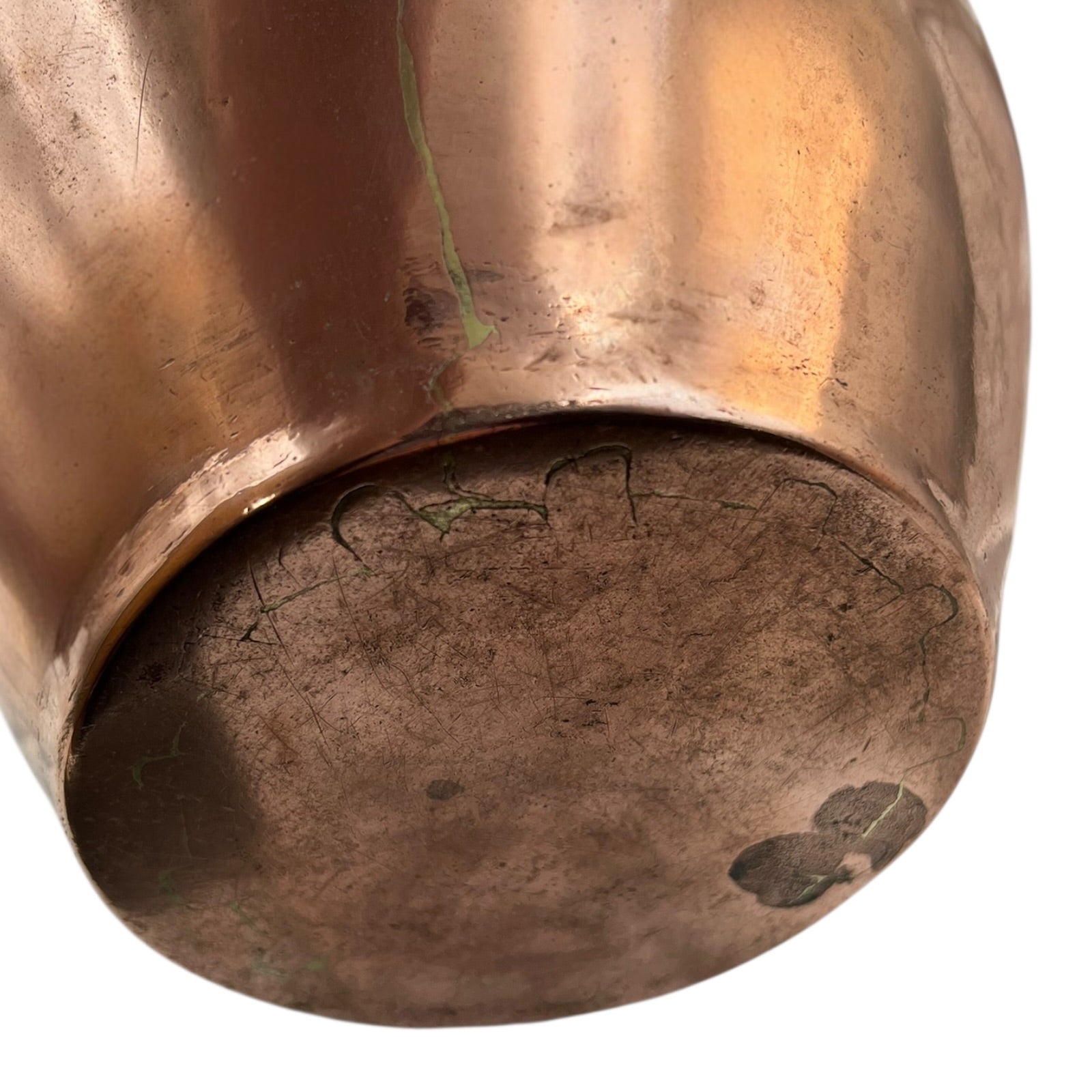 Close up of a copper cooking pot stockpot with handles on a white background