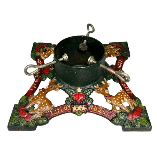 Decorative Christmas Tree holder with reindeer, berries, and 'Joyeux Noel' text on a white background