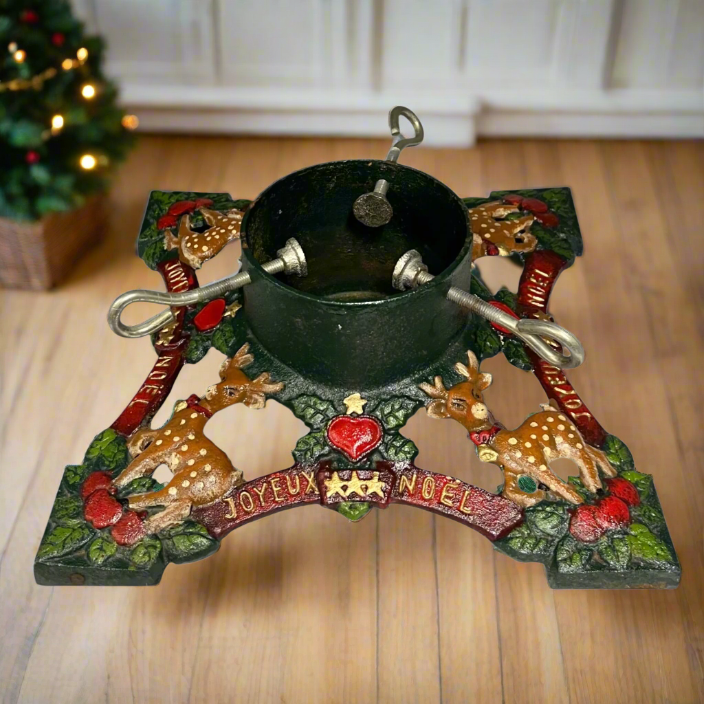 Decorative Christmas Tree holder with reindeer, berries, and 'Joyeux Noel' text on a wooden floor in a cosy home for sale from All Things French Store