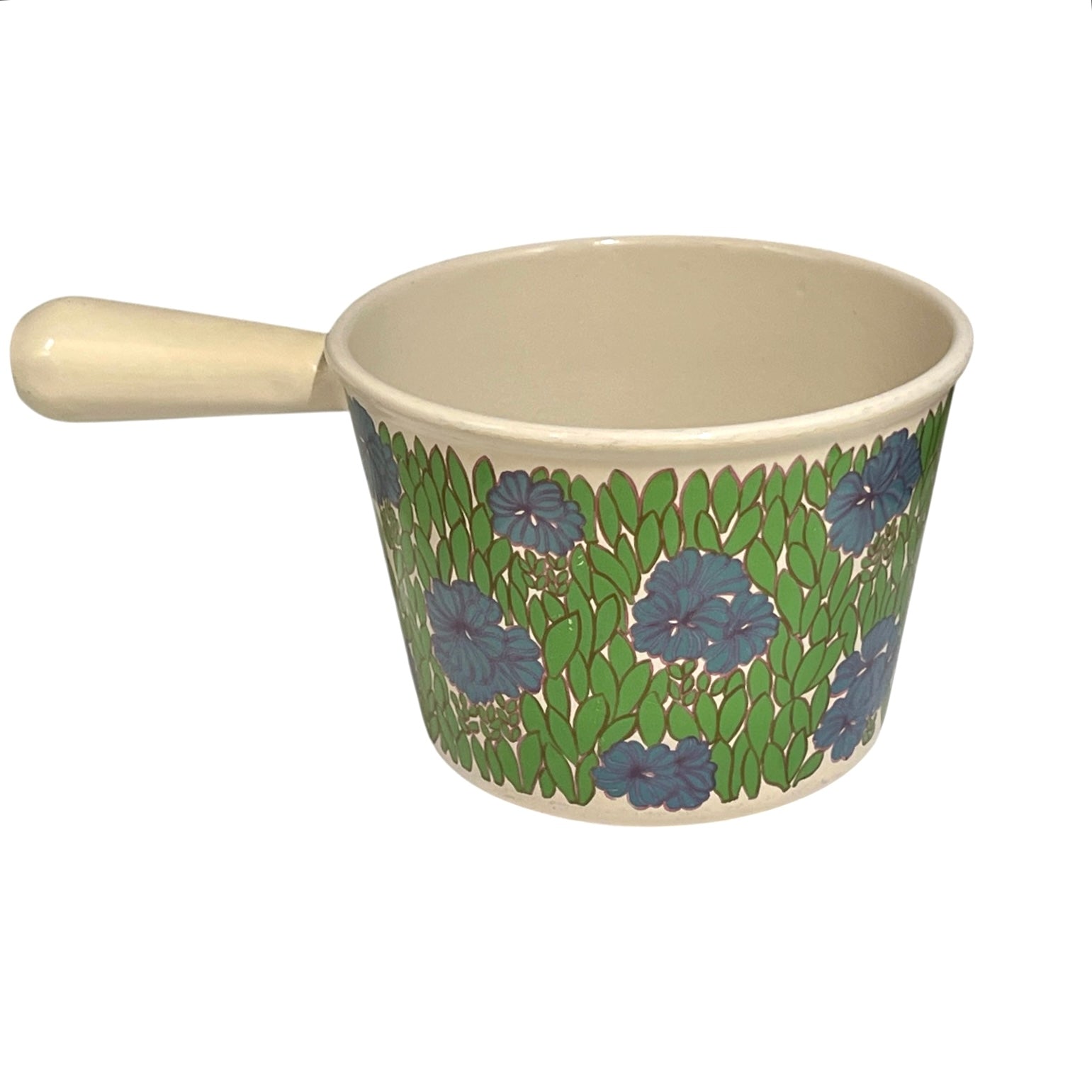 Vintage Le Creuset cast iron fondue pan in rare 1970s floral design, with blue flowers and green leaves, styled on a white background Shown from the side