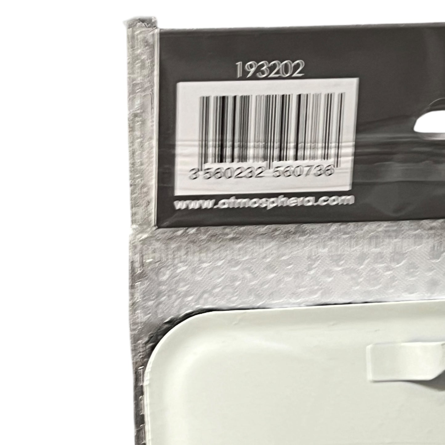 Bar code label on a product packaging with a visible brand name.
