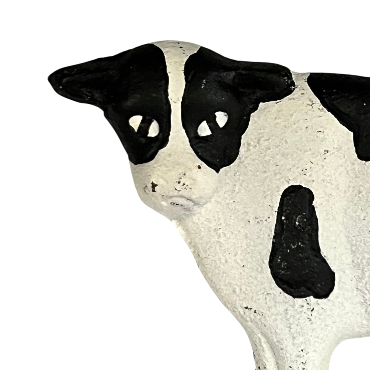 Close-up of a cow-shaped toiler paper roll holder  on a white background