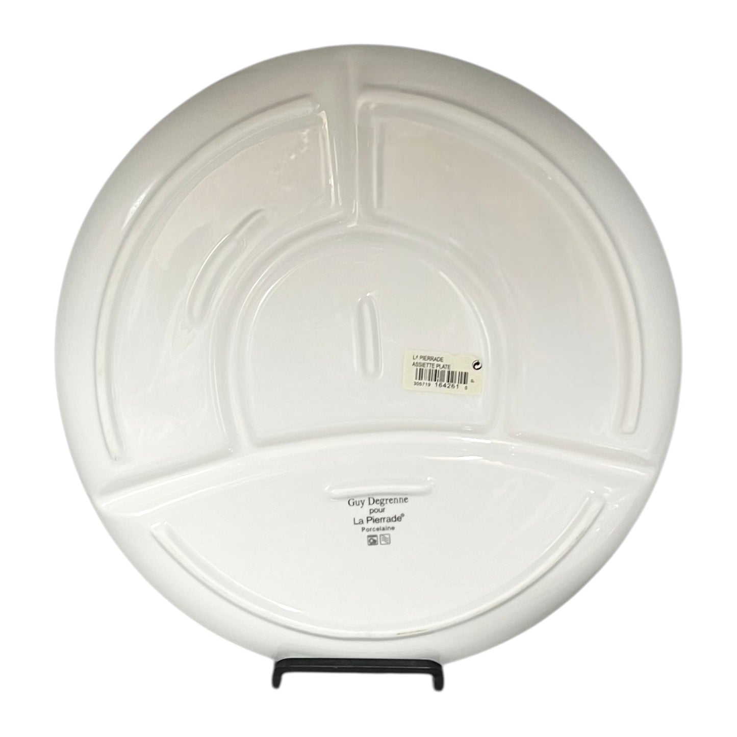 White sectioned plate with a label on a white background