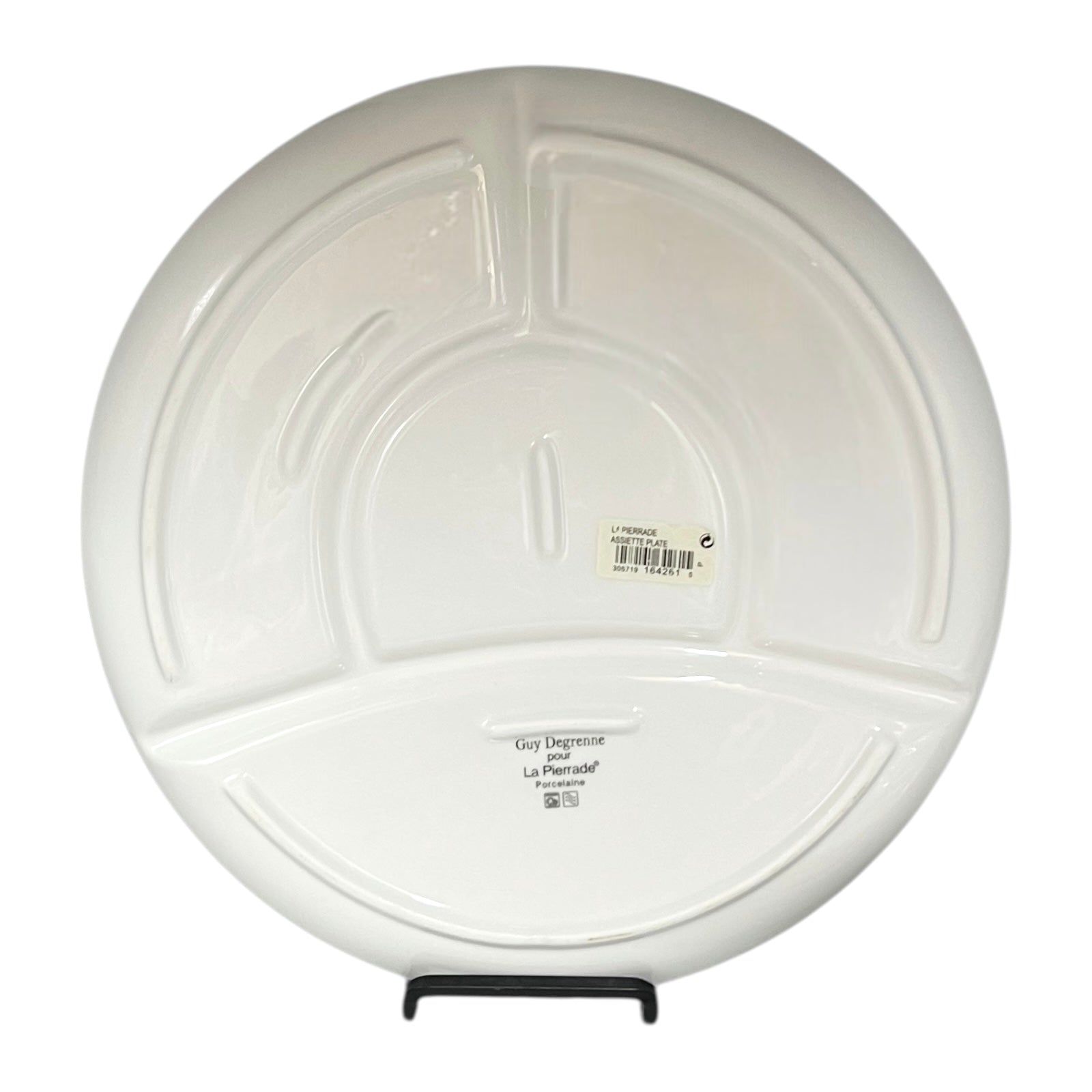 White sectioned plate with a label on a white background