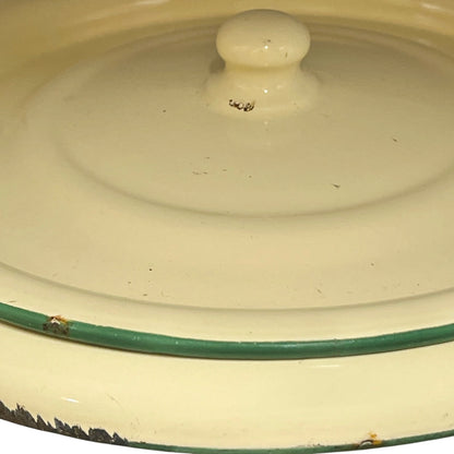 Close up of a French enamel bucket on a white background 