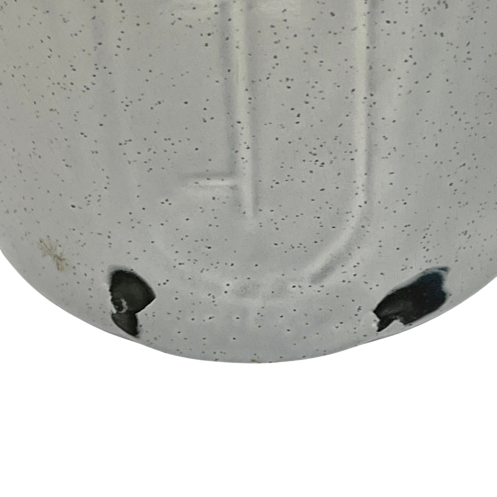 Close-up of a enamel planter with speckled pattern on a white background