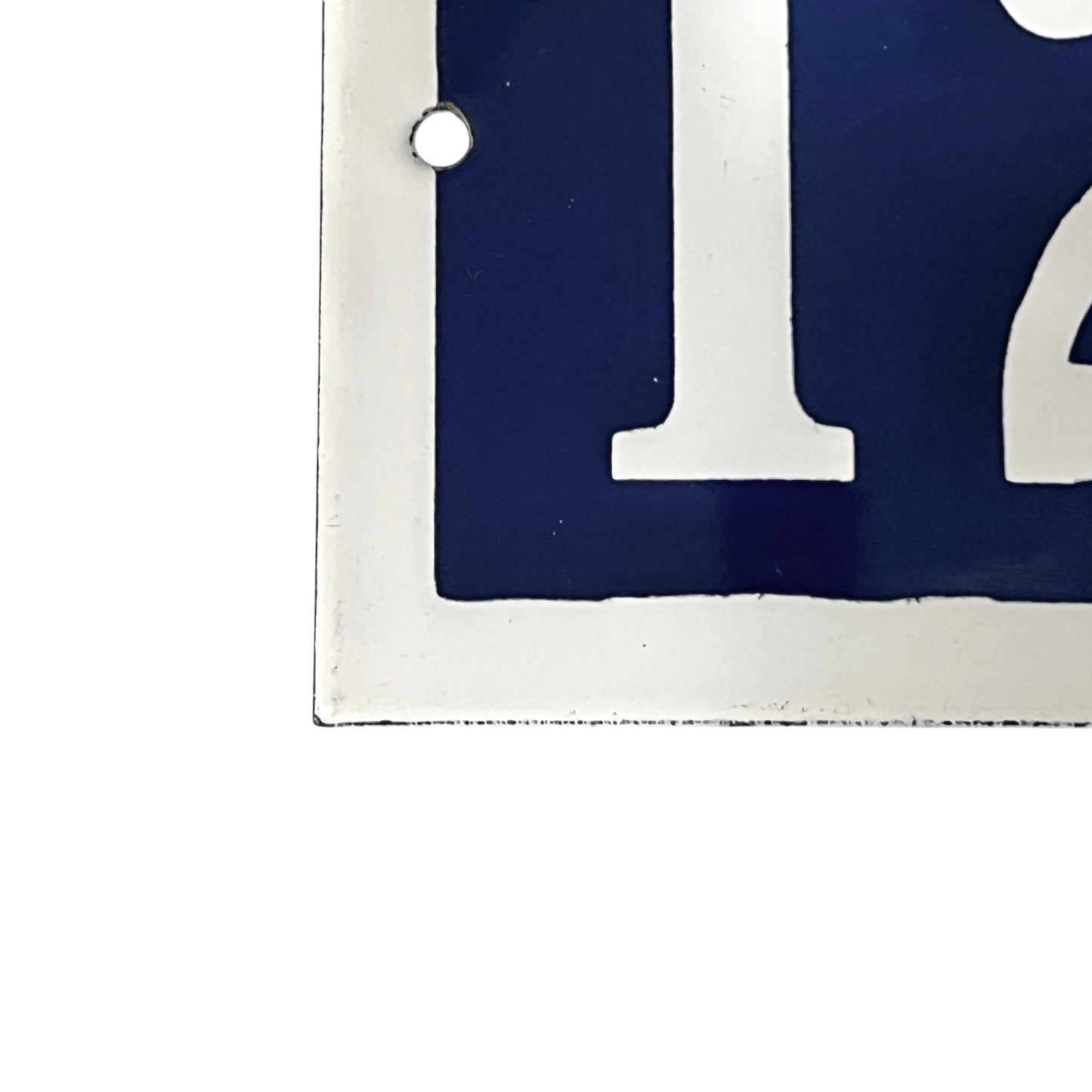 Close-up of a blue and white number  on a white background
