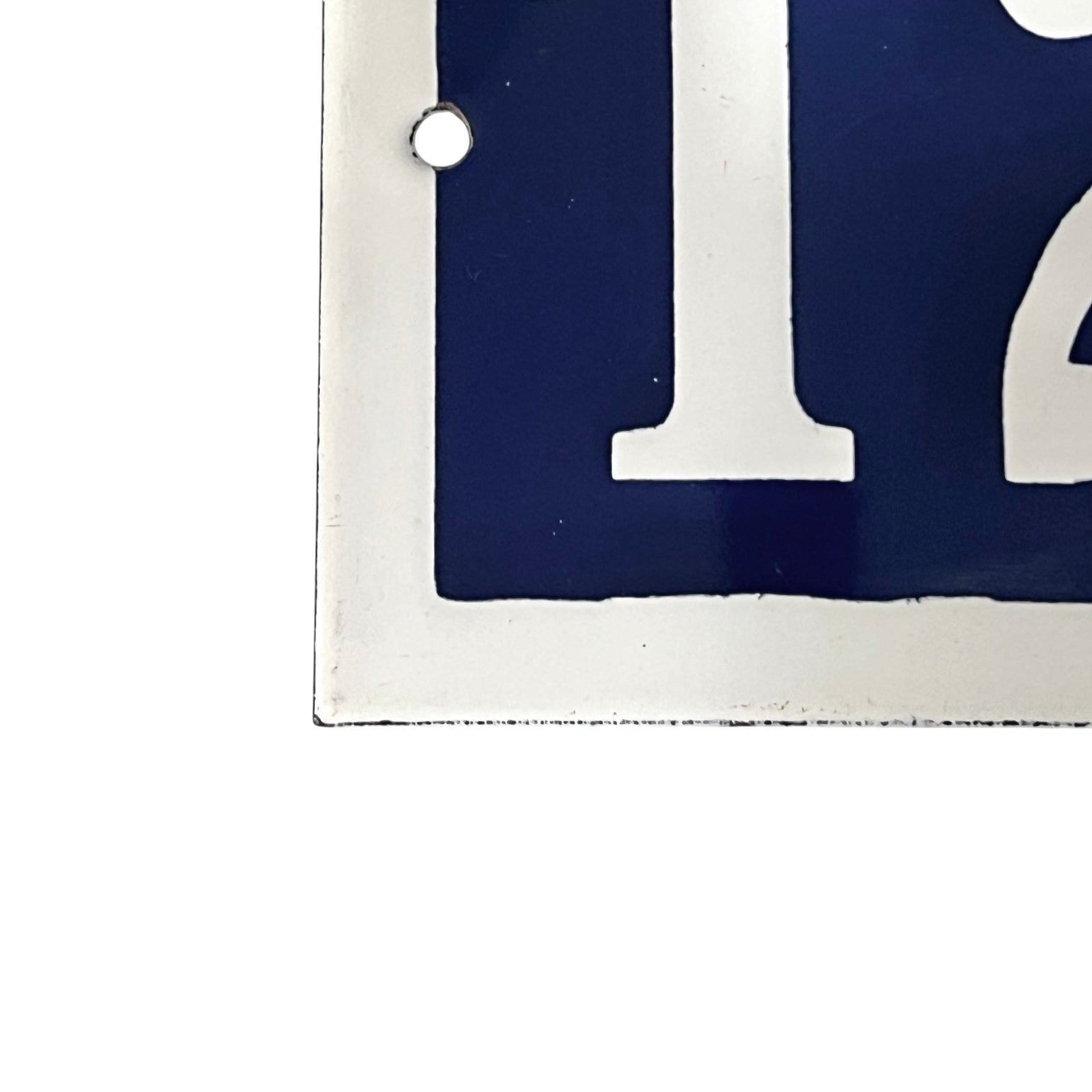 Close-up of a blue and white number  on a white background