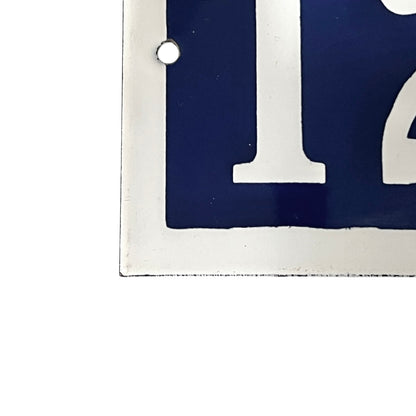 Close-up of a blue and white number  on a white background