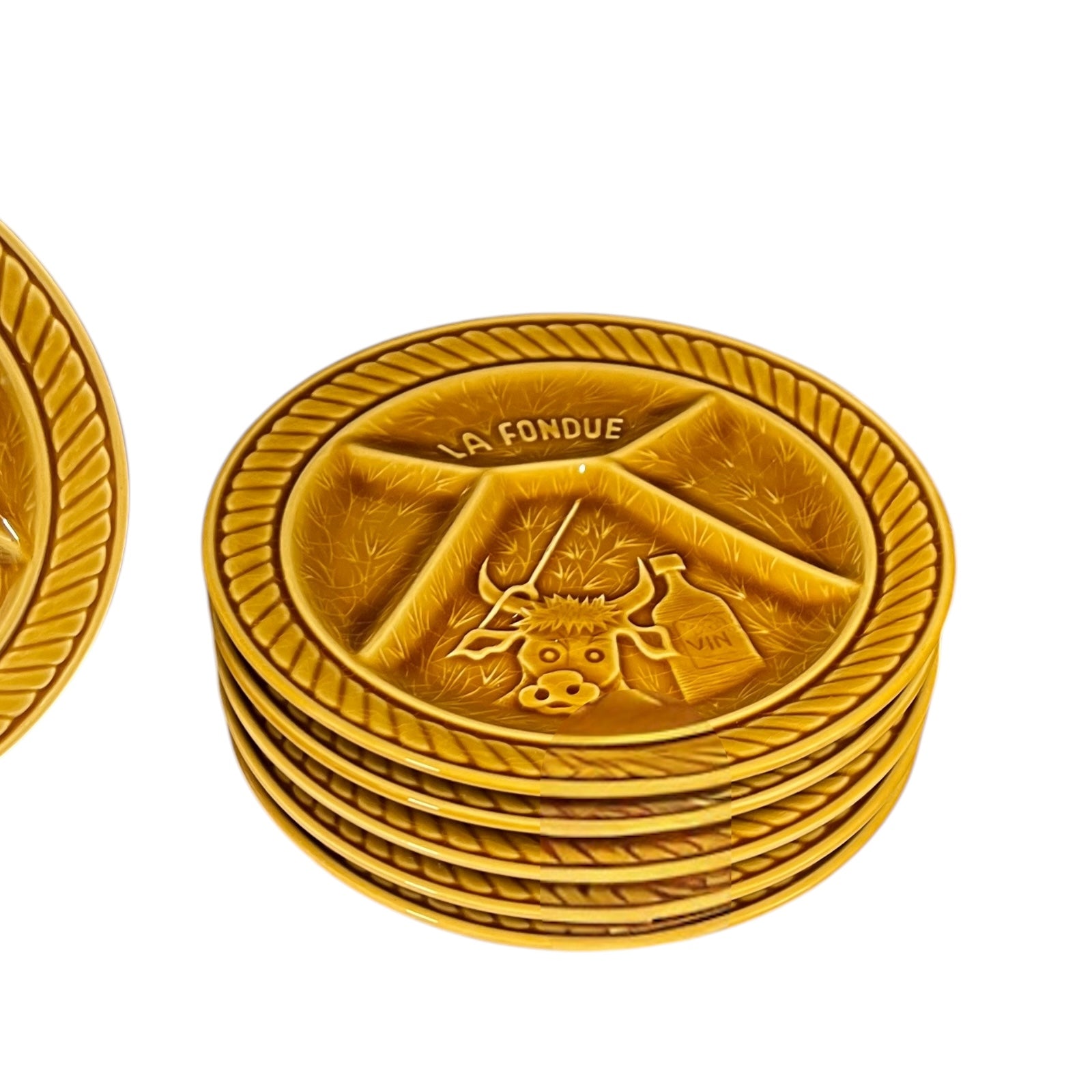Stack of fondue plates with 'La Fondue' branding on a white background