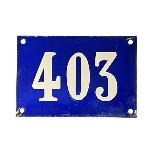 Blue rectangular plate with white numbers '403' on a white background