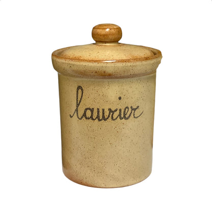 A small speckled ceramic canister with a matching lid and knob, featuring the word 'laurier' written in black cursive on the front, set against a plain white background.