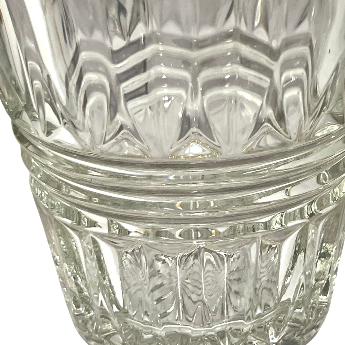 Close-up of a clear glass with diamond cut pattern