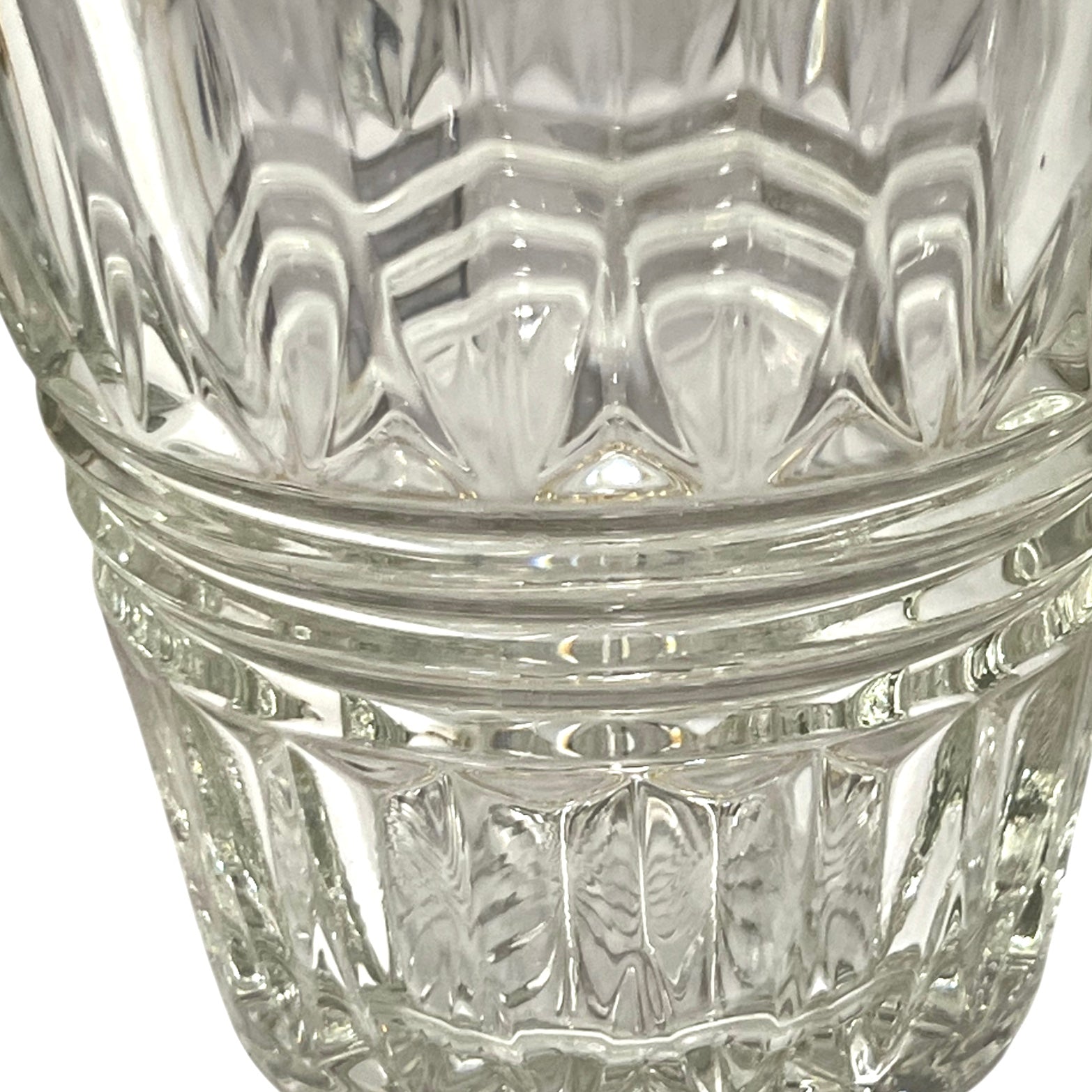 Close-up of a clear glass with diamond cut pattern