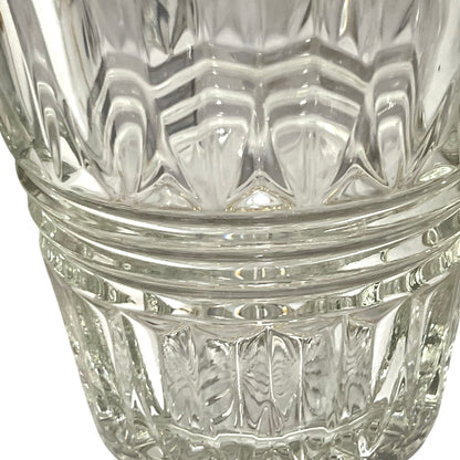 Close-up of a clear glass with diamond cut pattern