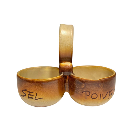 Ceramic salt and pepper shaker set with 'SEL' and 'POIVRE' writing on a white background