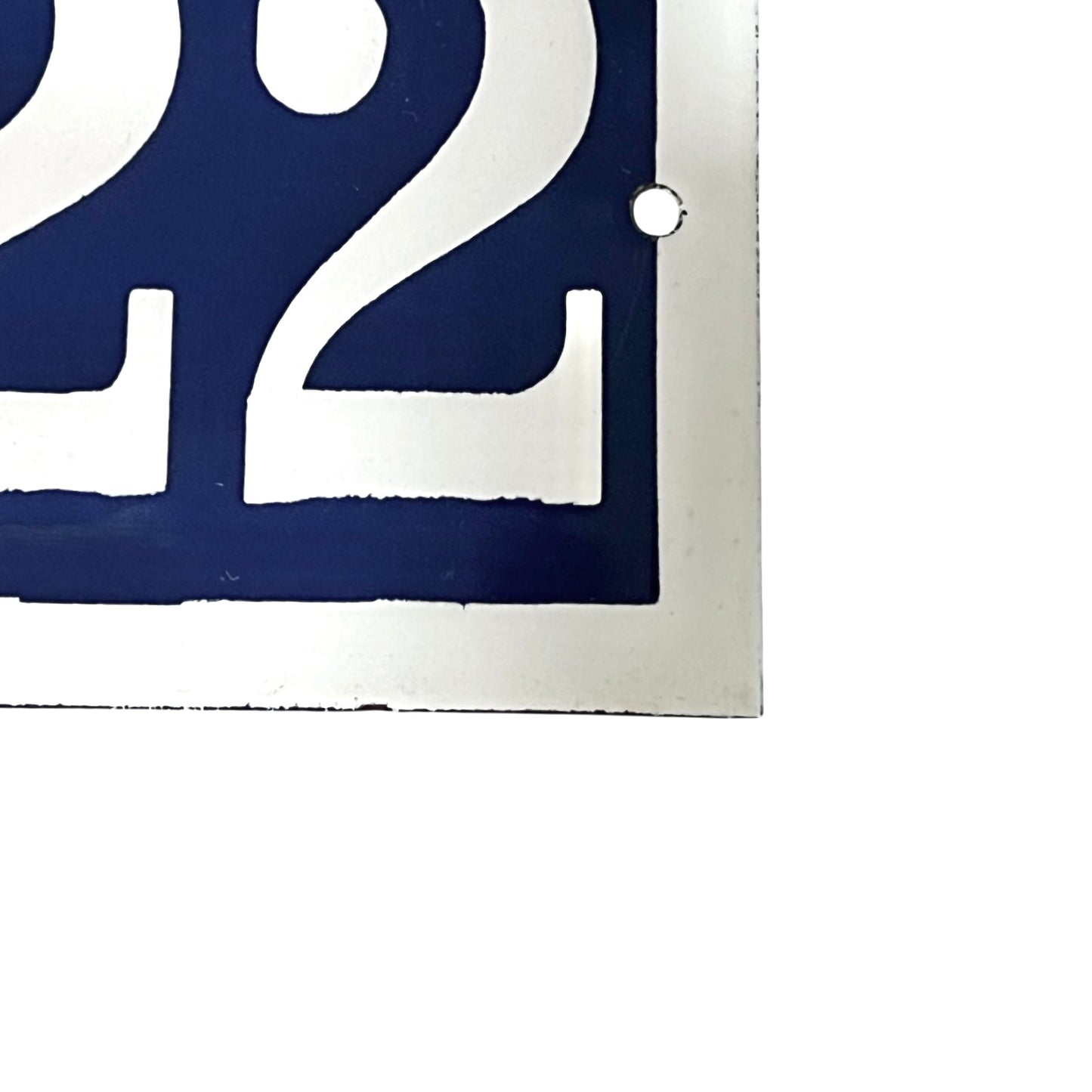 Close-up of a blue and white number '2' on a white background