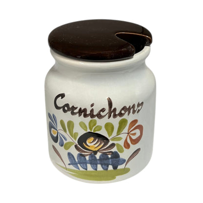 A charming decorative ceramic jar adorned with a floral design and the word 'Cornichons', perfect for adding a rustic touch to a country cottage or farmhouse kitchen, set against a clean white background.