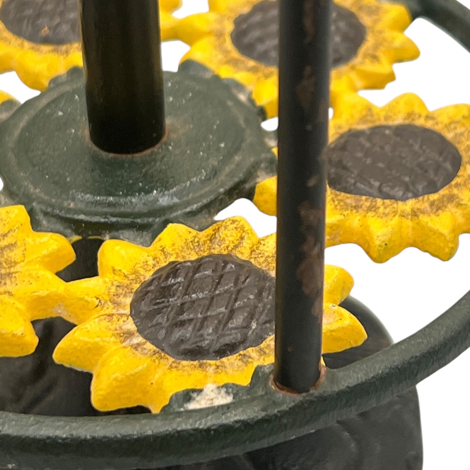 Close-up of a sunflower decoration on a kitchen paper towel stand on a white background