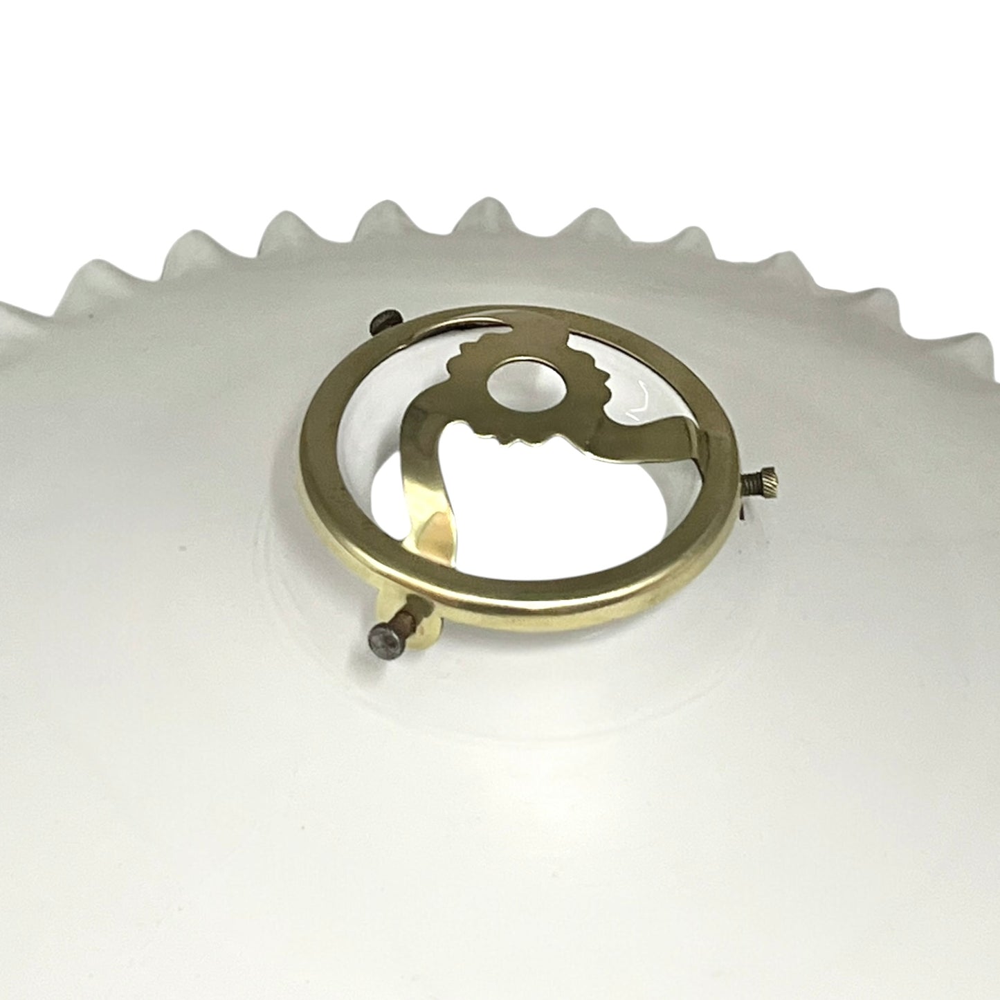 Close-up of a brass lampshade gallery on a white background