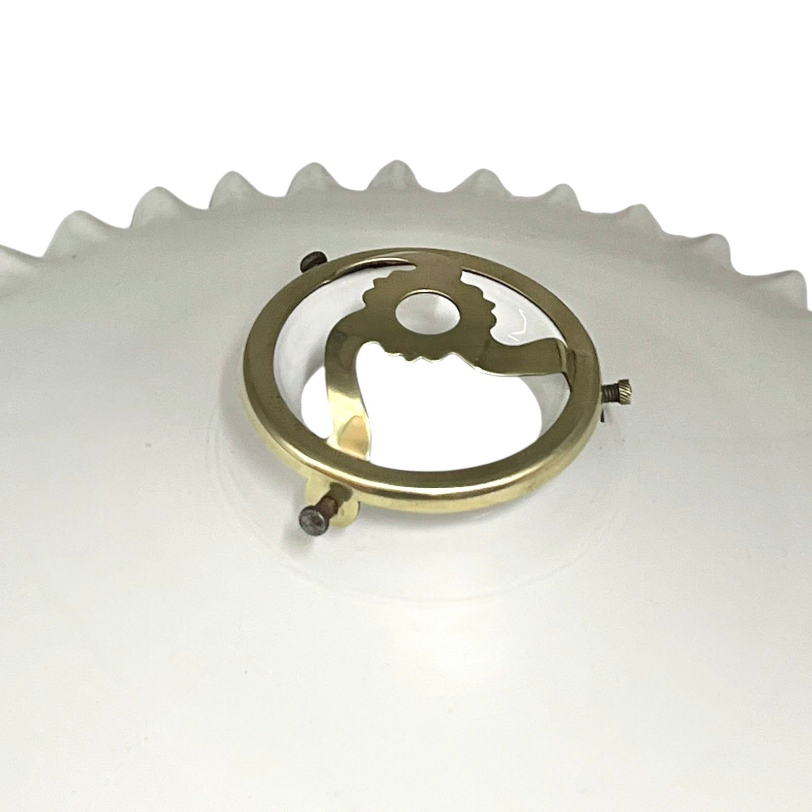 Close-up of a brass lampshade gallery on a white background