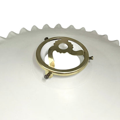 Close-up of a brass lampshade gallery on a white background