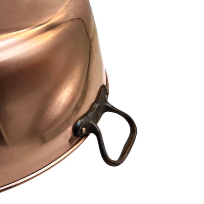 Close up of a copper sink on a white background 