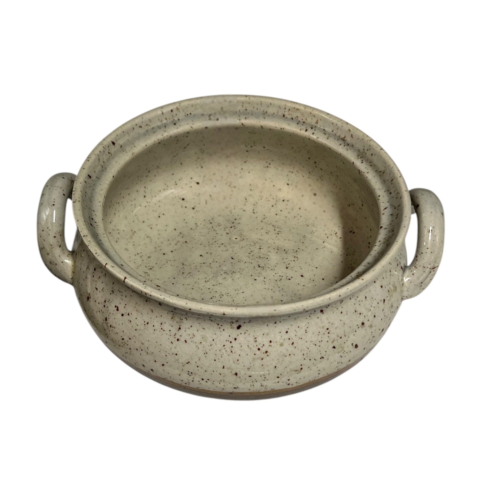 Close up of a speckled ceramic container on a white background