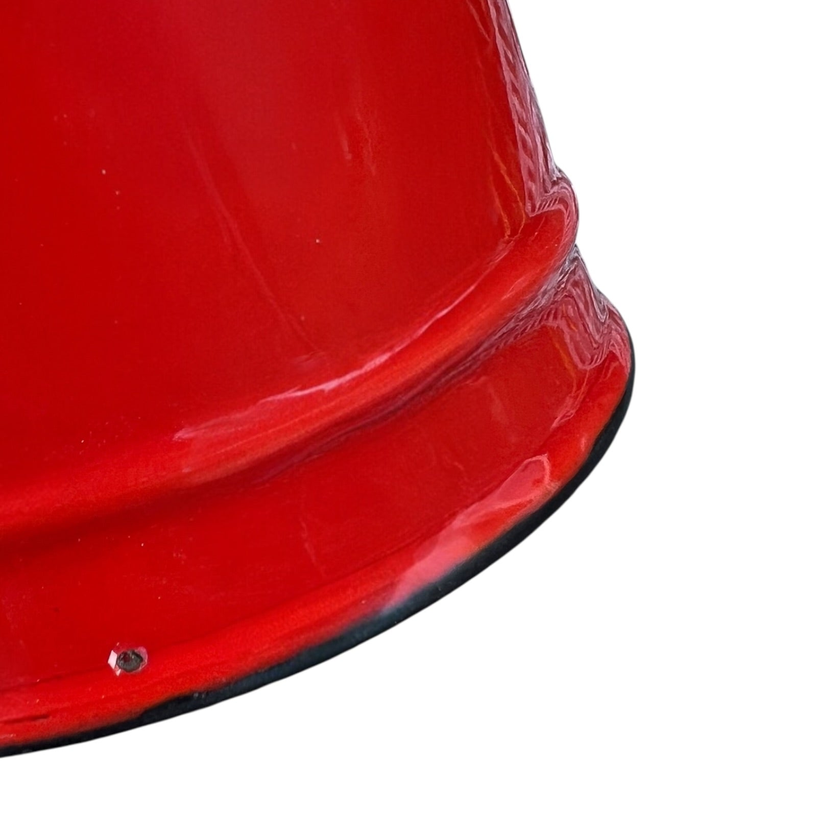 Close up of a red vintage French enamelled coffee pot on a white background