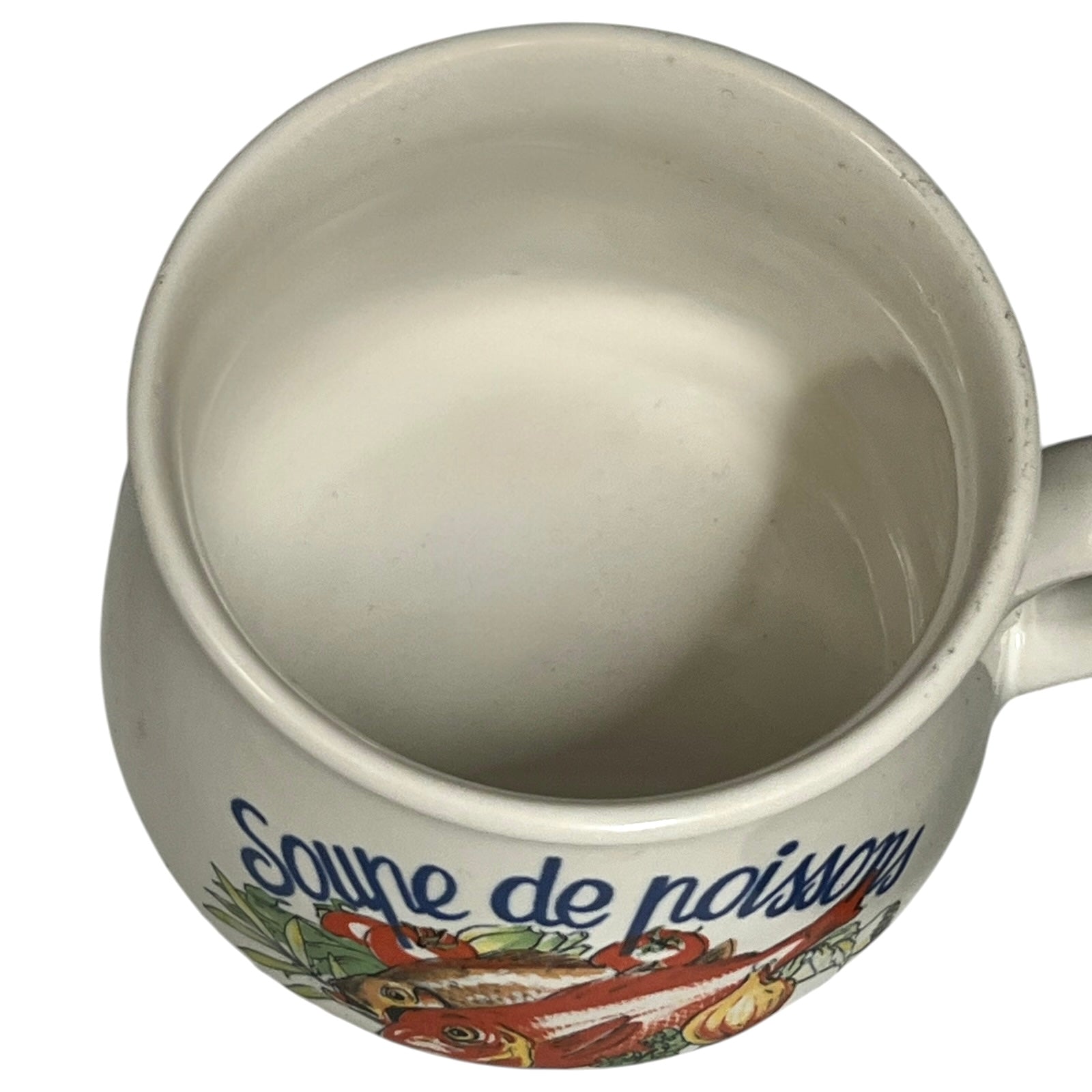 Ceramic mug with decorative design and text on a white background