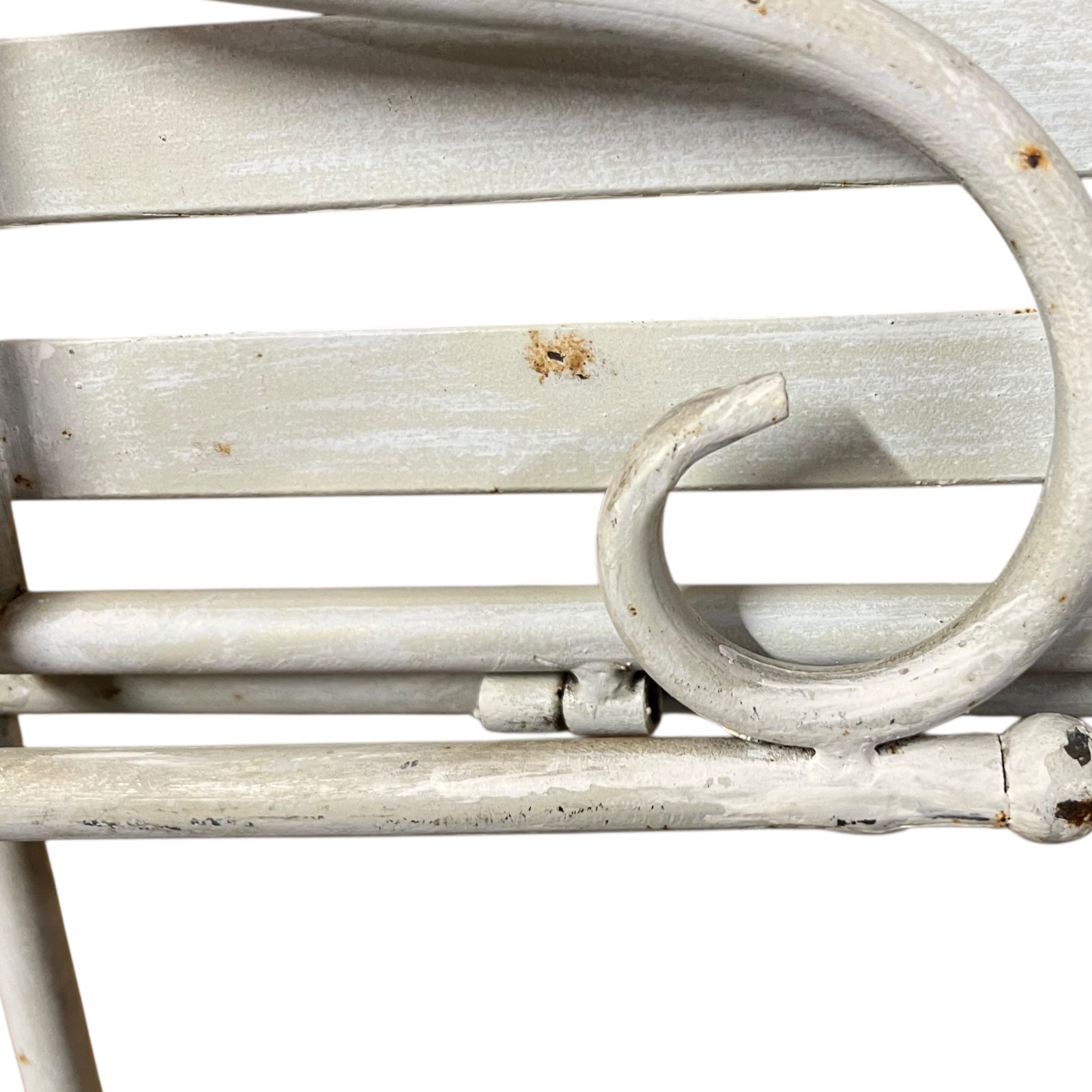 Close-up of a metal she with visible wear and tear on a white background