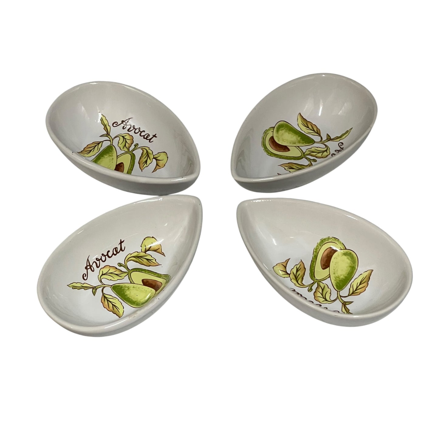 Four small white ceramic avocado-themed bowls arranged on a white background. Each bowl is decorated with an illustration of an avocado and the word 'Avocado' in script.
