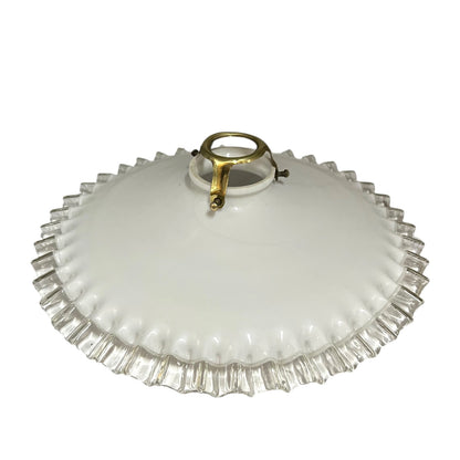 A vintage white glass ceiling light shade with a scalloped, fluted edge and a central gold metal ring handle, shown against a plain white background.