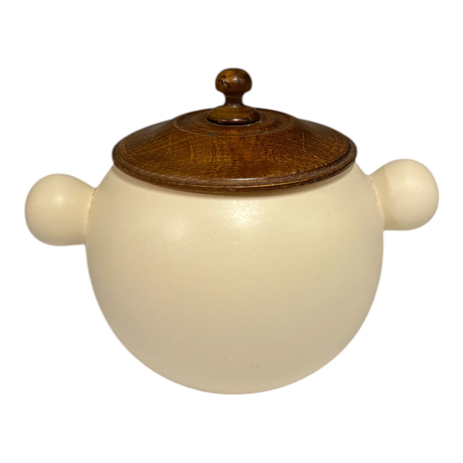 Ceramic jar with wooden lid on a white background