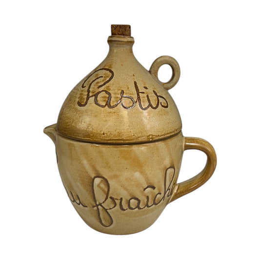 Ceramic container with 'Pastis' and 'fraçais' text on a white background