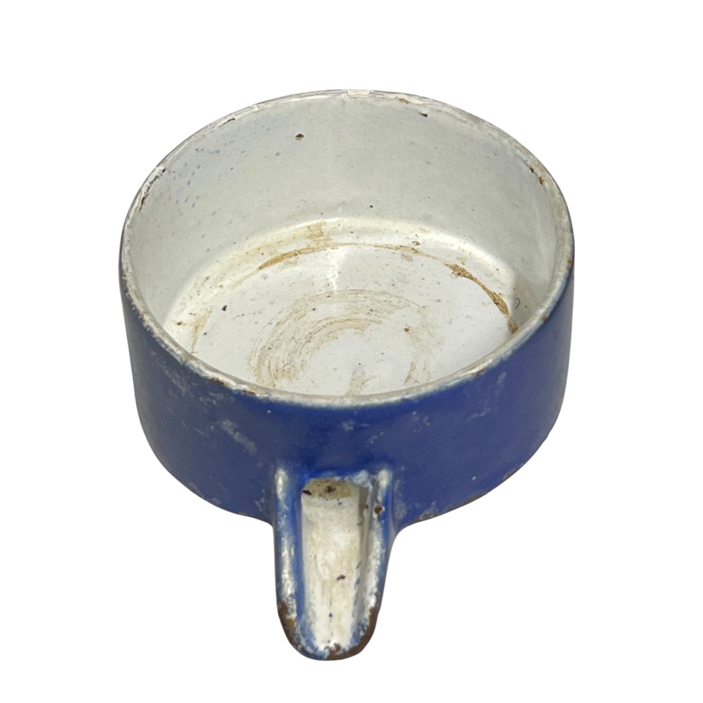 Close-up of a vintage fruit press with a blue pot on a white background