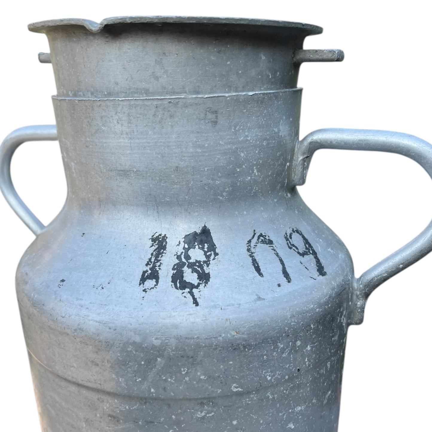 Close up of a Vintage French aluminium milk churn with a lid on a white background