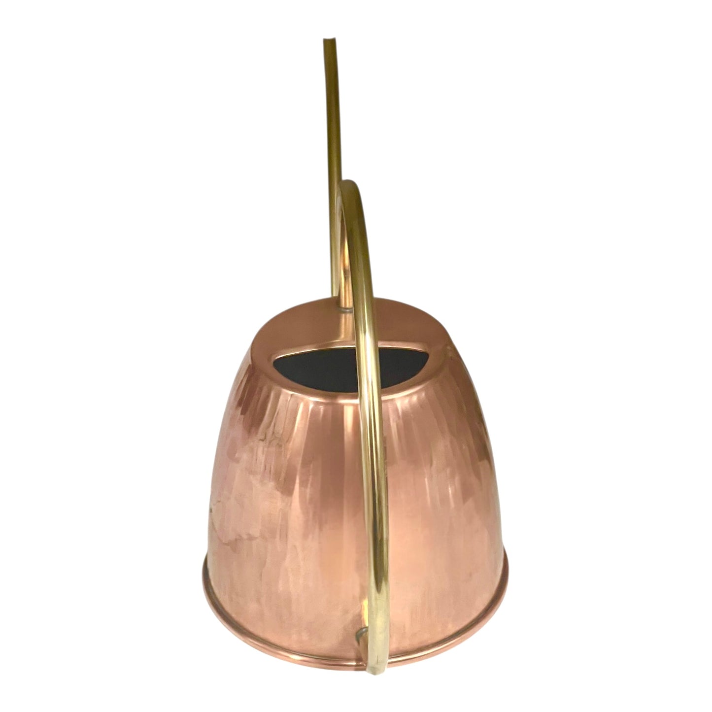 Copper and brass watering can on a white background