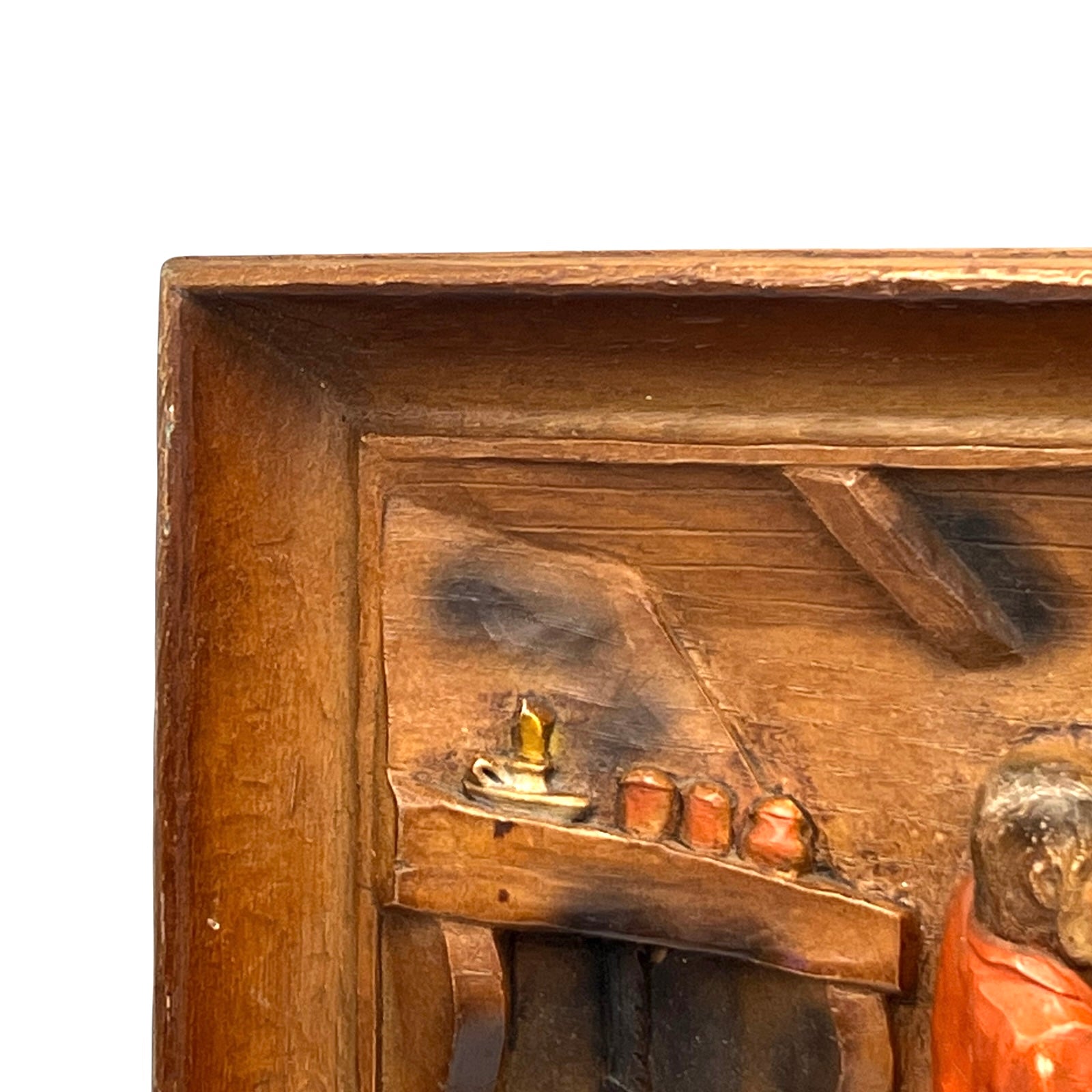 close up of wooden relief sculpture in an arts and crafts style on a white background