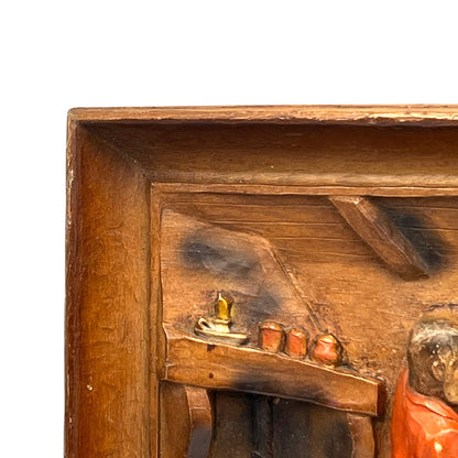 close up of wooden relief sculpture in an arts and crafts style on a white background