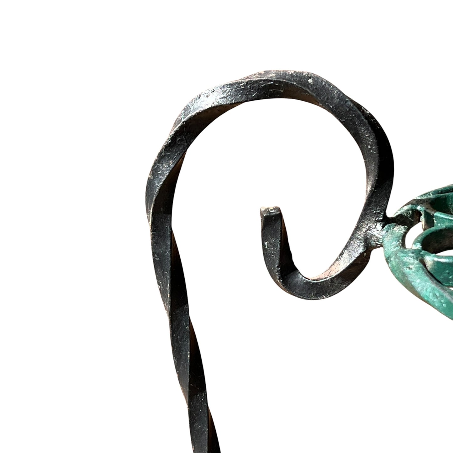Close up of a wrought iron vintage plant stand on a white background 