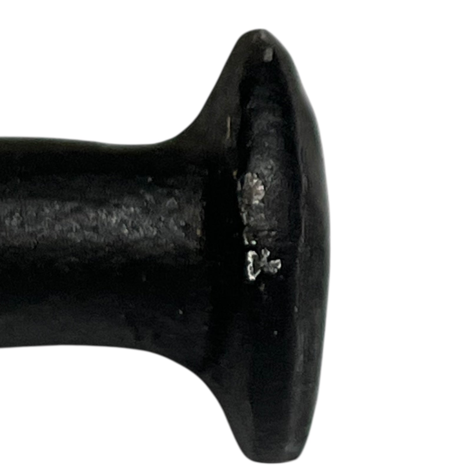 Close up of cow toilet paper holder with black and white pattern on a white background