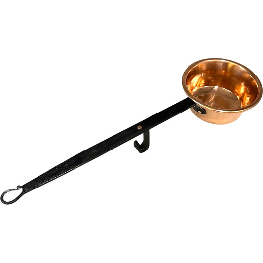 Copper ladle with a black handle on a white background