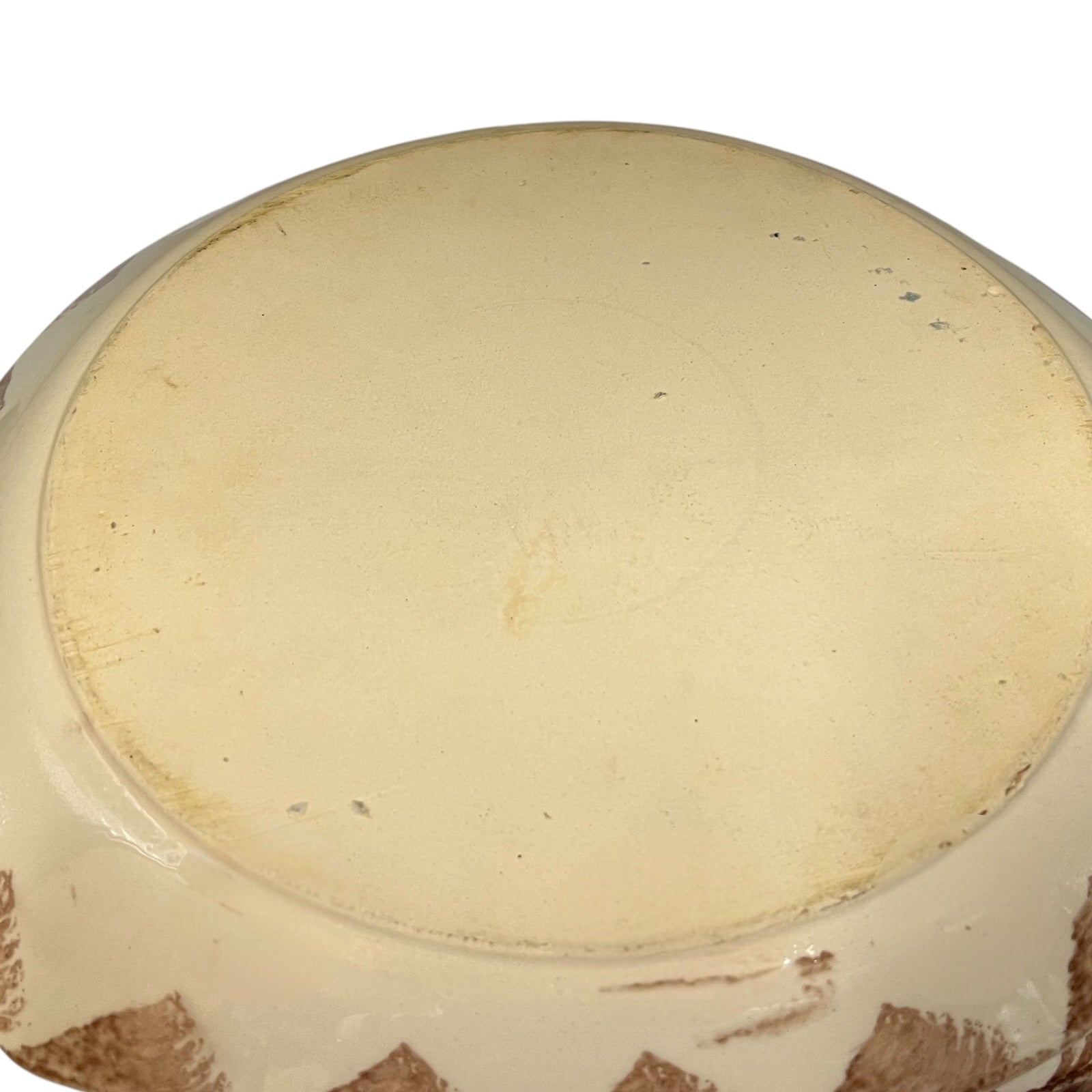 Reverse of a French dinner plate on a white background
