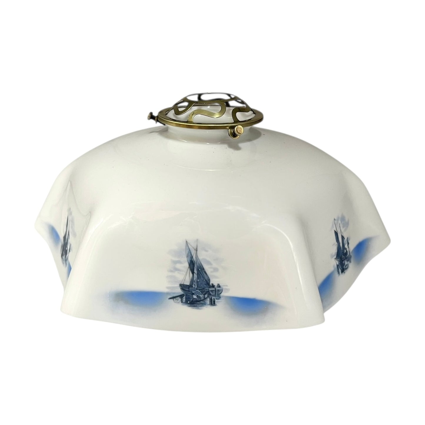 Decorative lamp shade with blue ship designs on a white background