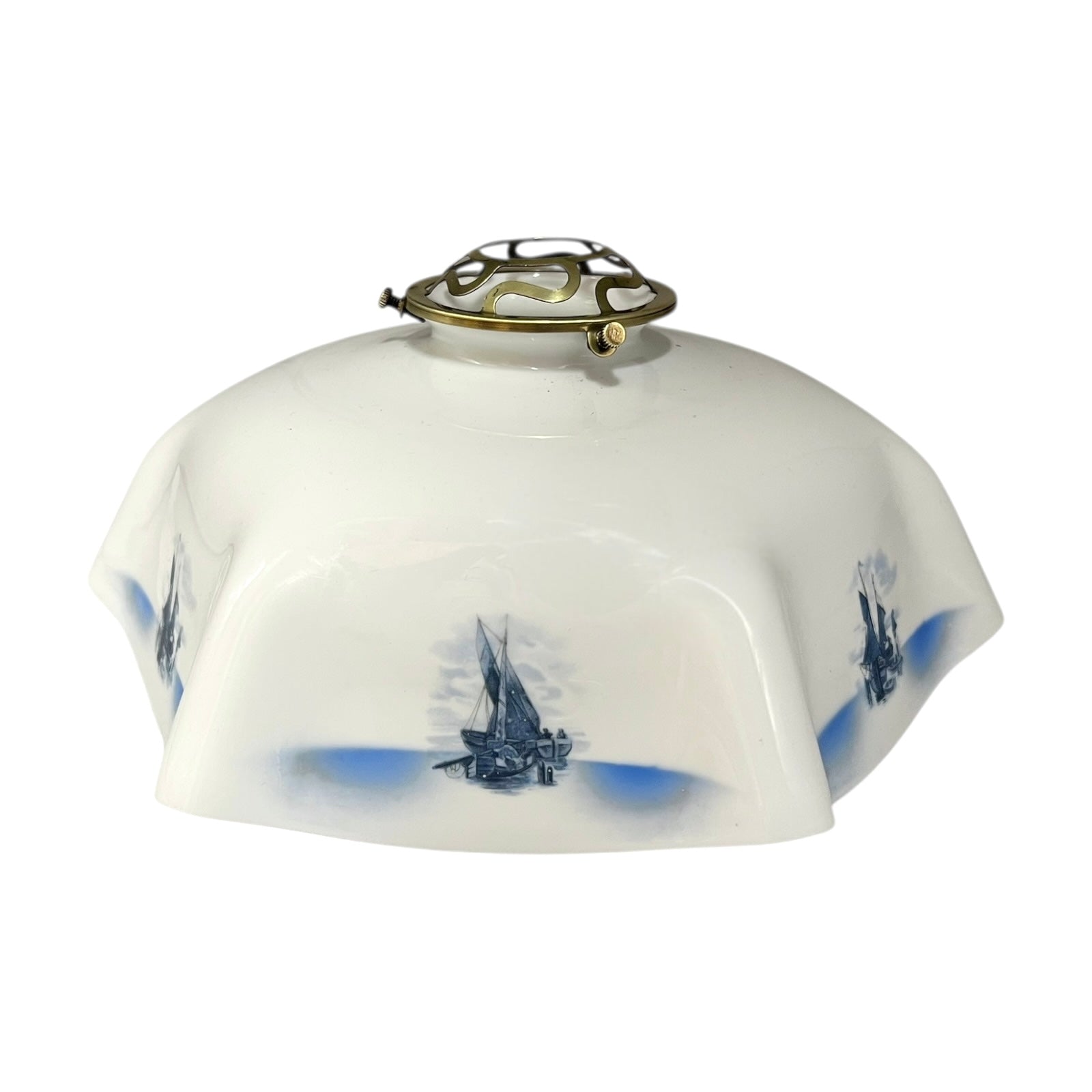 Decorative lamp shade with blue ship designs on a white background
