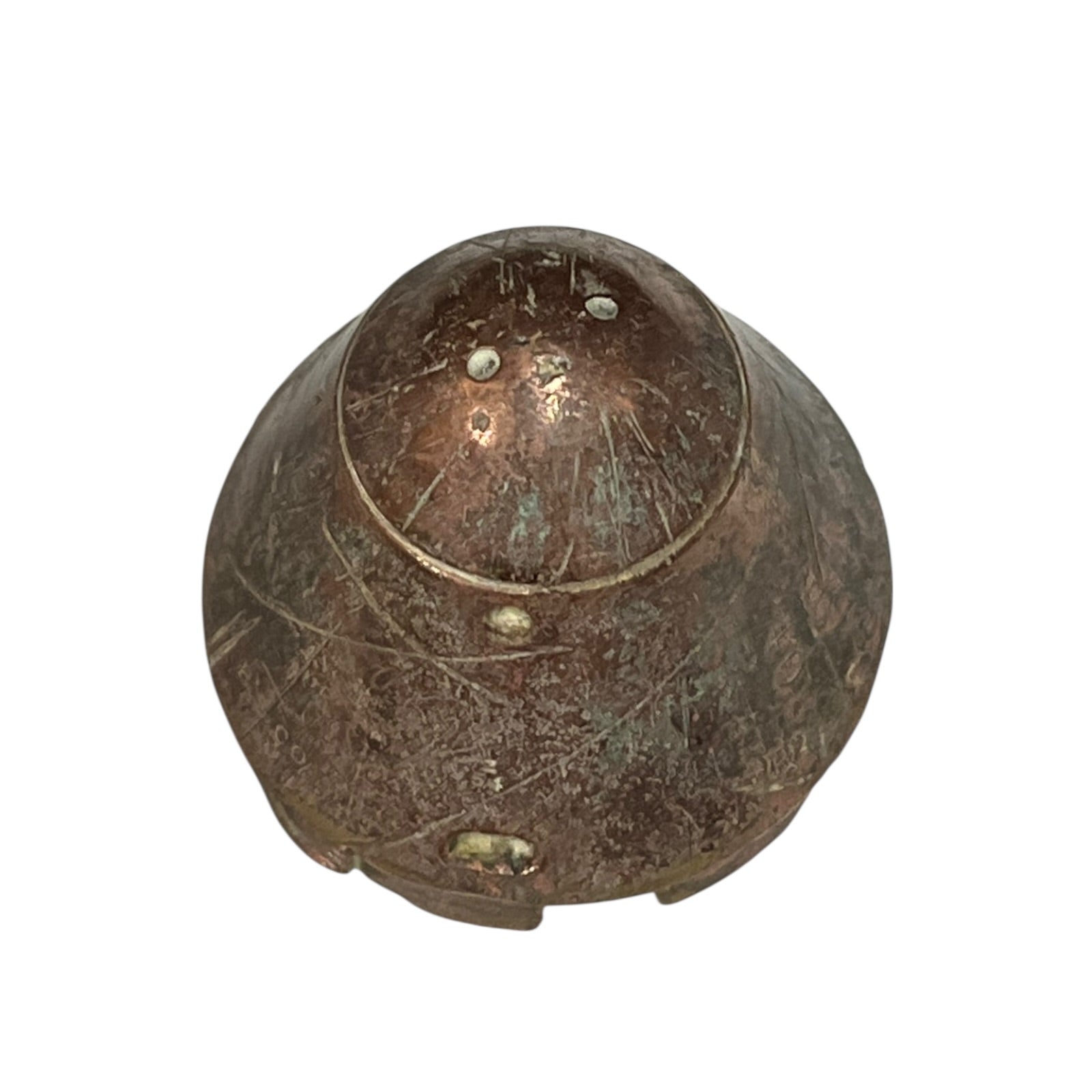 WW1 British brass fuse now repurposed as a paperweight on a white background