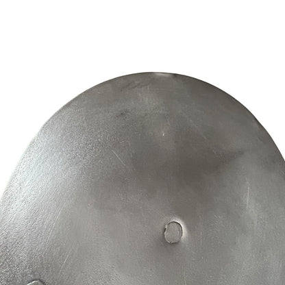 Close up French copper pan lid showing hand wiped traditional new tin lining  on a white background
