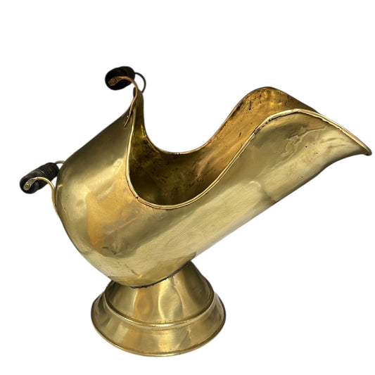 Brass coal hod bucket with 2 wooden handles on a white background